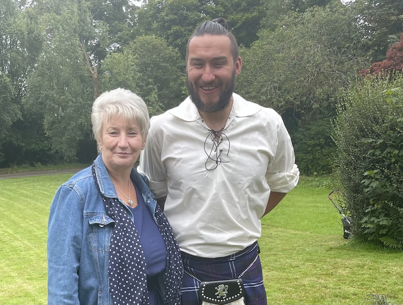 two happy people in a large green garden